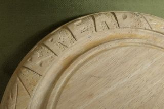VINTAGE CARVED WOOD BREAD BOARD 11 3/4 inches diameter. 3