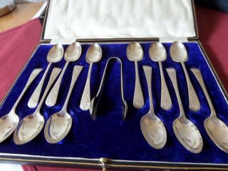 A Cased Set Of 12 Hallmarked Solid Silver Spoons And Tongs