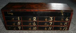 Antique Miniature Mahogany Bank Of Twelve Numbered Drawers With Hinged Lid