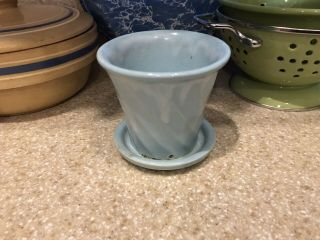 Vintage Blue Flower Pot With A Swirl Pattern.