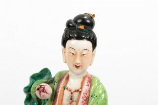 A Chinese Antique Famille Rose Porcelain Guanyin Statue On Wooden Stand.
