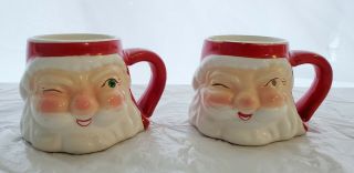 2 Vintage Christmas Holt Howard Santa Claus Face Winking Ceramic Cups Mugs 1960