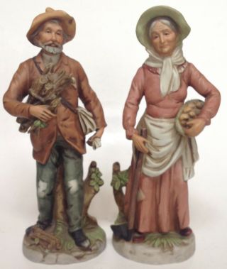 Vintage Bisque Homco 8884 Porcelain Old Lady And Man Carrying Wood Figurine Set