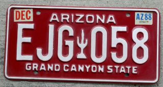 White On Maroon Arizona " Cactus " License Plate With A 1988 Sticker