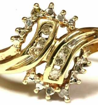 10k yellow gold.  08 ct SI2 H round diamond cluster ring 2.  4g estate vintage 2