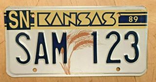 1989 Kansas Sample Wheat Graphic Auto License Plate " Sam 123 " Ks 89