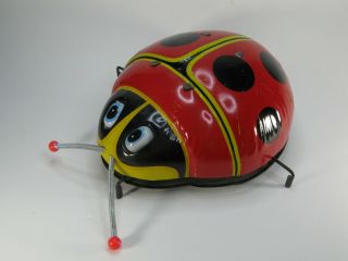 Vintage Large Tin Litho Lady Bug By Mikuni Made In Japan Friction Twirling Toy