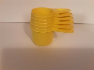 Vintage Set Of 6 Yellow Tupperware Measuring Cups.