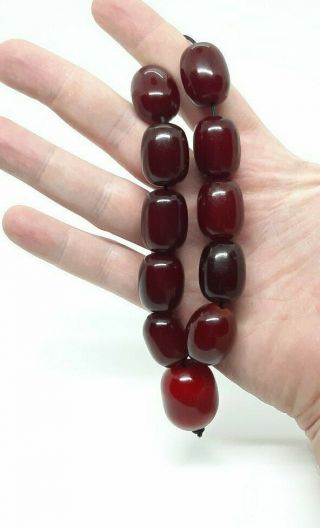 61.  5 Grams Antique Faturan Cherry Amber Bakelite Beads.