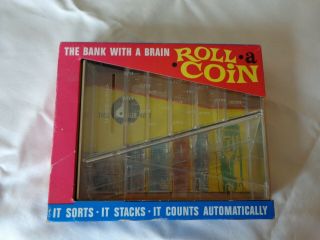 Vintage " Roll - A - Coin " Bank With A Brain,  Package Or Opened