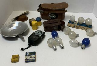 Vintage Argus Camera,  Brown Leather Case,  Flash Bulbs,  Film Cans Light Meyer Etc