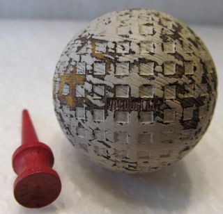 Vintage Vacuum Cup Square Mesh Golf Ball And A Wood Tee Both Circa 1930 