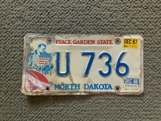 1986 1987 North Dakota Car Dealer License Plate Teddy Roosevelt U 736