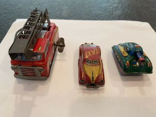 Vtg Tin Litho Japan Gmen? Toy Car Taxi.  Trade Mark Suzuki Tank.  Yoke Fire Truck