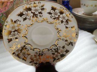vintage queen anne tea cup and saucer gold chintz and single red rose 3