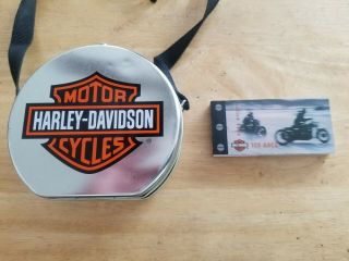 Harley - Davidson Limited Edition Collectors Tin 1999.  And 2002 Action Book