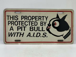 This Property Is Protected By A Pit Bull With A.  I.  D.  S.  Vintage License Plate