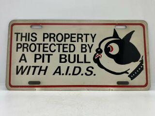 This Property Is Protected By A Pit Bull With A.  I.  D.  S.  Vintage license Plate 2