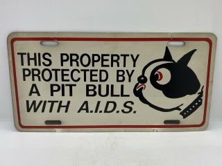 This Property Is Protected By A Pit Bull With A.  I.  D.  S.  Vintage license Plate 3