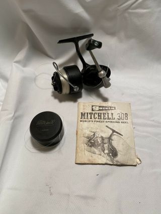 Vintage Mitchell 308 Spinning Reel With Extra Spool And Book.