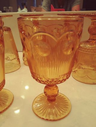 Set Of 5 Vintage Amber Indiana cut wine goblets,  and 4 footed water glass Set 3