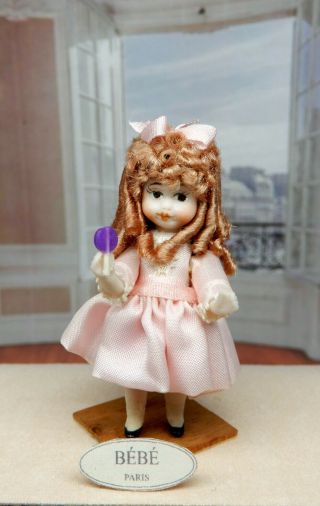 Vintage Tiny Miniature Jointed Porcelain Dollhouse Doll W Lollipop Miniature 2 "
