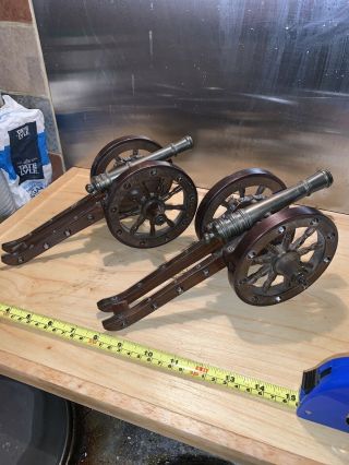 A Vintage Metal And Wood Model Field Cannons Guns