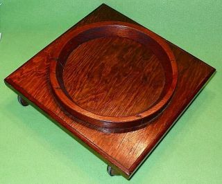 Vintage ROLLING wooden PLANT STAND w/ tapered ring.  Accommodates up to 7 