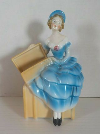 Antique German Porcelain Figural Vase Of A Lady Sitting On A Trunk 7 1/4 " Tall
