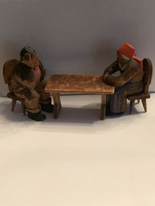 Vintage Hand Carved Wood Man & Woman Sitting On Chairs At A Table