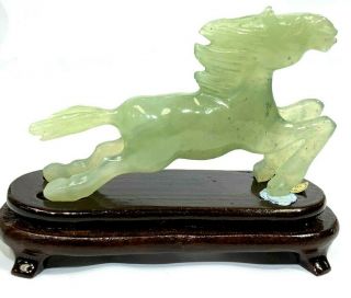 Chinese Hand Carved Horse Figurine On Wooded Stand.