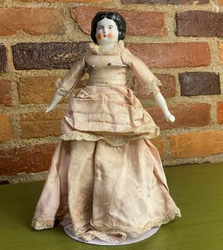 10 " Antique China Head Doll Low Brow Blue Eyes Curly Black Hair Pink Silk Dress
