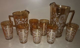 Vintage Cosmos Jeanette Amber Carnival Glass Set Of 2 Pitchers And 7 Glasses