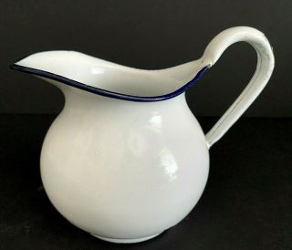 Vintage Small White Enamel Pitcher With Navy Blue Rim 4.  5 " Tall