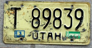 1974 Black On White Utah Apportioned License Plate With 1975 And 1976 Stickers