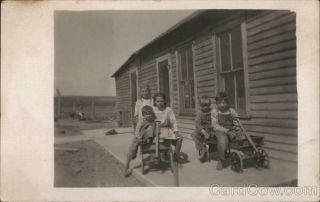 Rppc Children On The Back Porch In Toy Wagons Azo Real Photo Post Card Vintage