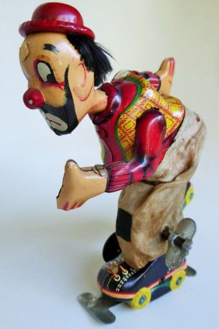 Vintage T.  P.  S.  Japan Clown On Roller Skate Tin Lithographed Mechanical Toy