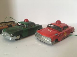 Two Vintage 1960s Marx Linemar Tin Battery Light Up Car Toys,  Fire Chief & Camo