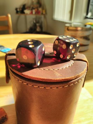 Vintage leather dice cup with a variety of bakelite poker dice and dice 2