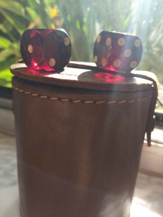 Vintage leather dice cup with a variety of bakelite poker dice and dice 3