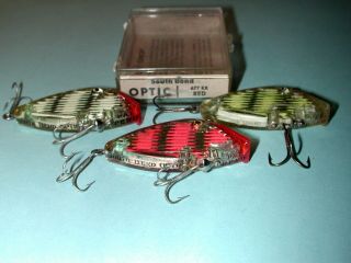 Trio of South Bend Optic lures. 2