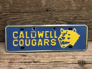 Vintage Caldwell Cougars High School Idaho Souvenir License Plate Topper