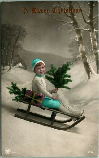 Vintage " A Merry Christmas " Rpc Photo Postcard Boy On Sled W/ Xmas Tree - 1917