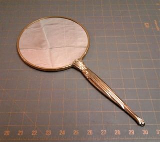 Vintage Hand Held Vanity Mirror Gold Color And Gold Fabric Back