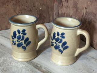 2 Vintage Pfaltzgraff Folk Art Coffee Cups / Mugs Tan With Blue Accents