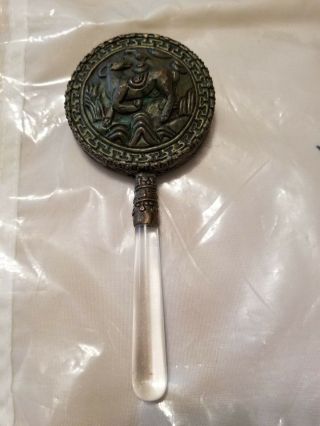 Small Round Hand Mirror With Glass Handle Backing Is Carved Copper Design