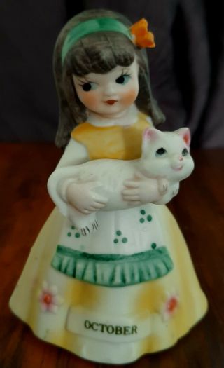Vintage Ceramic Girl Figurine W/yellow Dress & Apron Holding Cat Oct.  Birthday