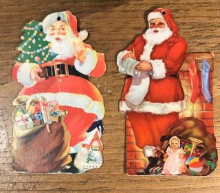 2 Vintage Cardboard Santa Claus Christmas Club Bank Advertising Ornaments
