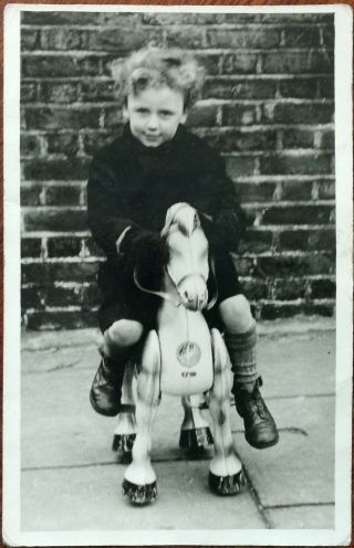 Vintage Photograph Of A Boy On A Rocking Horse