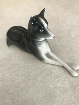 Vintage Ceramic Dog Made In Germany Sitting Down Paws Crosses Figurine